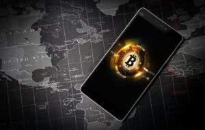 A golden Bitcoin coin standing upright on a reflective surface, with financial charts and market data displayed in the blurred background, symbolising cryptocurrency trading and market trends.
