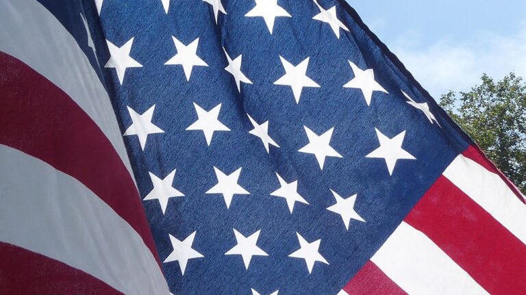 A high-resolution image of the American flag featuring white stars on a blue field and red and white stripes, symbolizing the United States' patriotism and national pride.